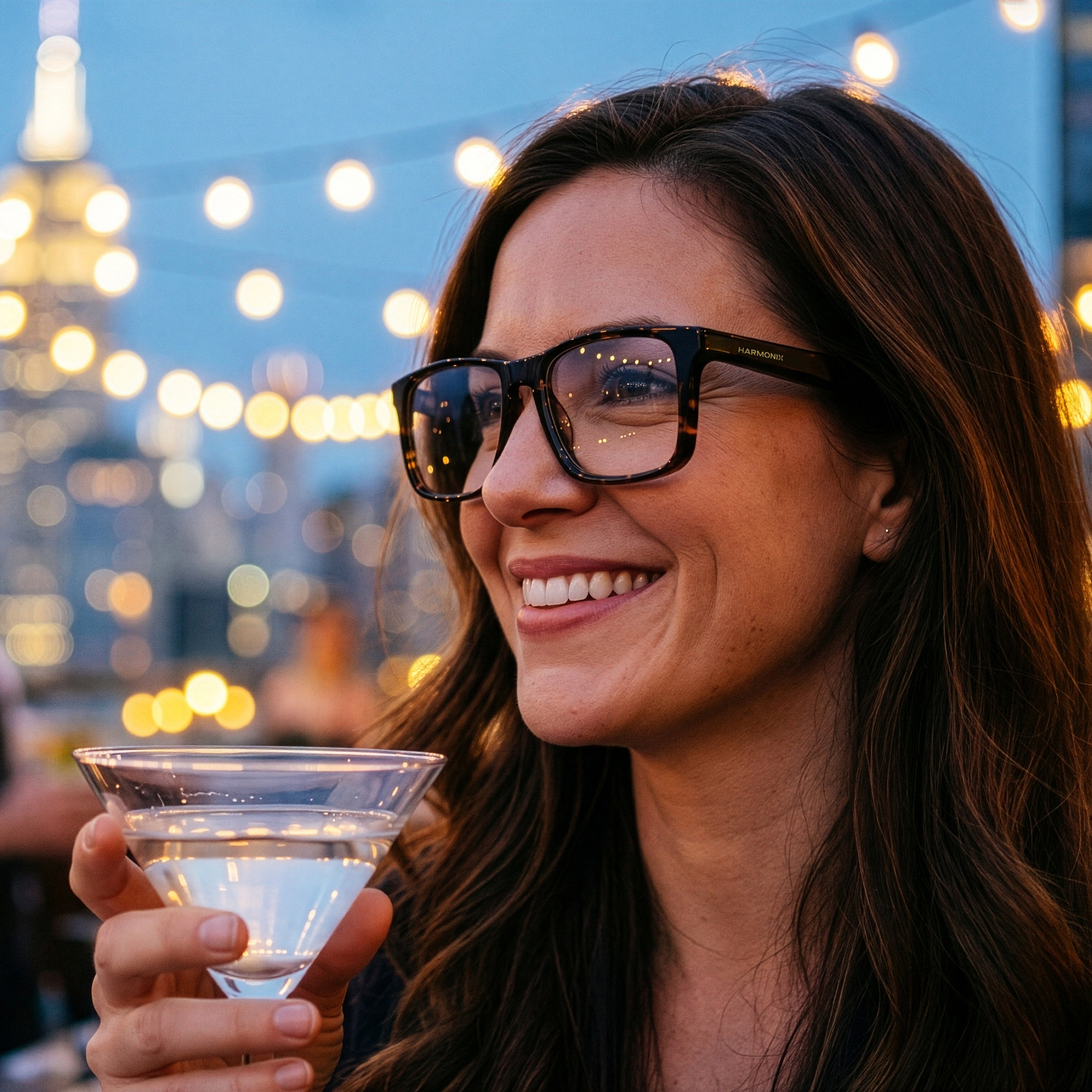 Person wearing SonaVue K-Man tortoiseshell audio glasses at a New York rooftop bar